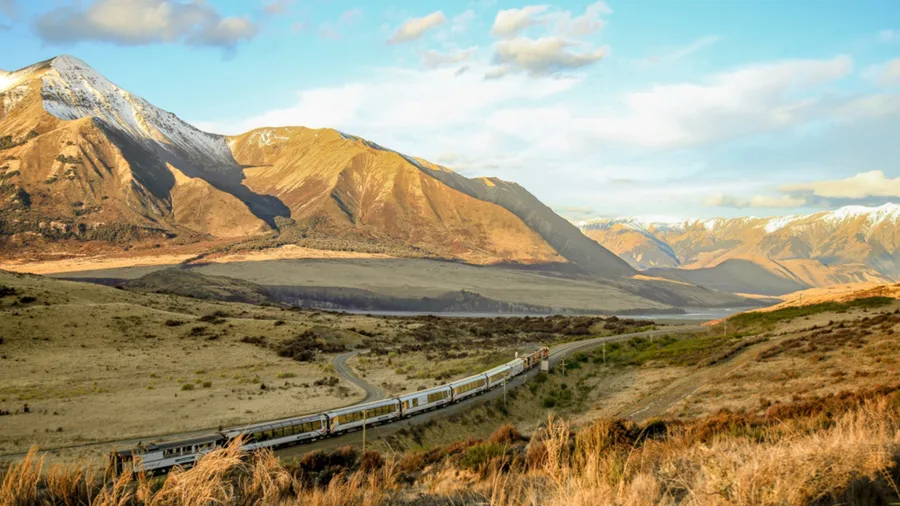 TranzAlpine train travelling past Mount Binser in Arthur’s Pass