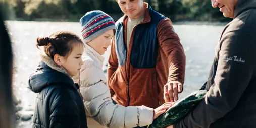Family discovering greenstone on West Coast TranzAlpine tour