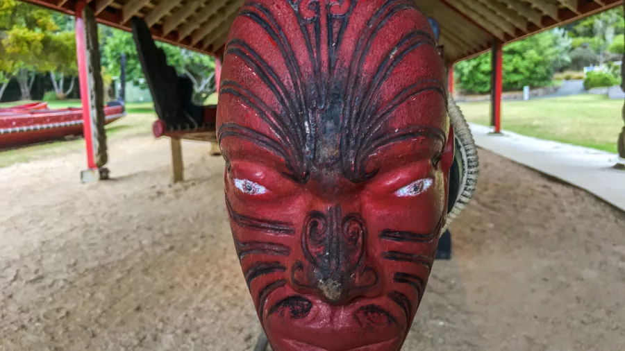 Close-up of a traditional Māori carved waka prow at the Waitangi Treaty Grounds