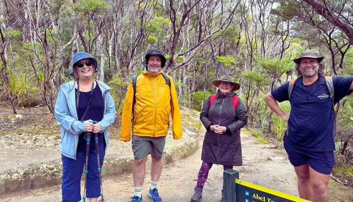 Guided group hike on the Abel Tasman Coast Track