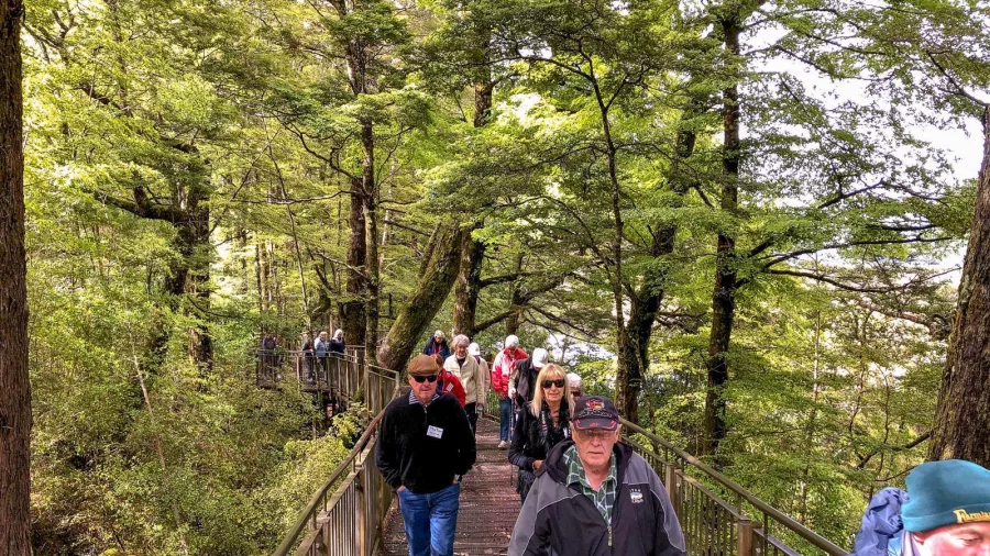 Visitors walking on boardwalk at Mirror Lakes