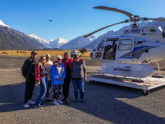 Moatrek guests beside scenic flight helicopter at Aoraki Mt Cook
