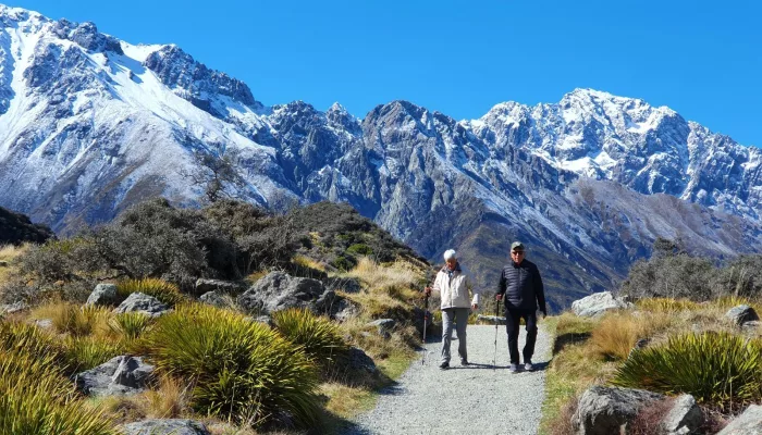 Guests walking scenic trail in Mount Cook National Park