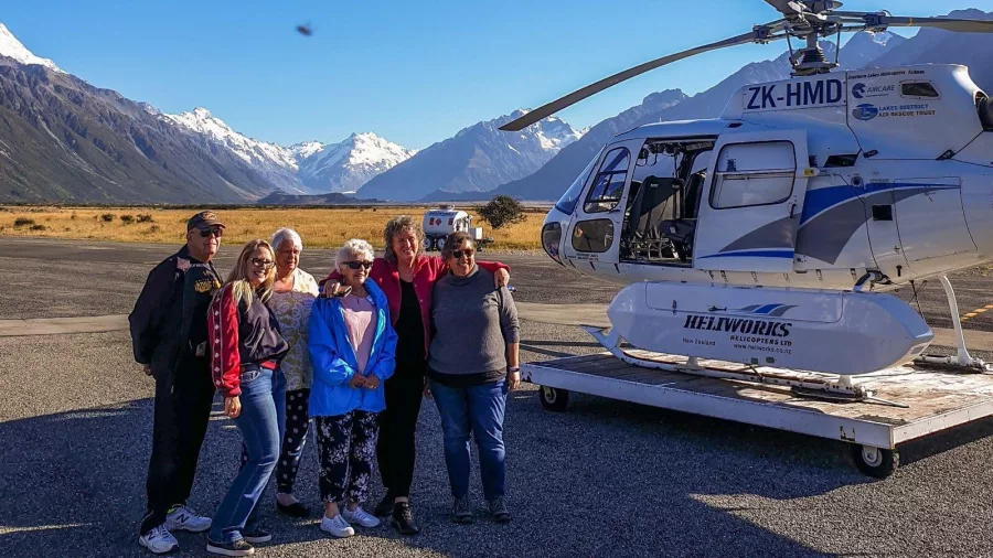 Moatrek guests beside scenic flight helicopter at Aoraki Mt Cook