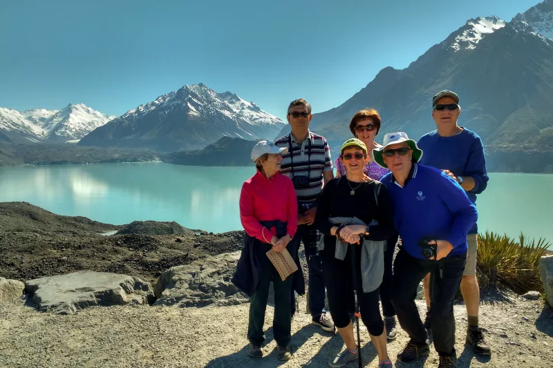 Moatrek travellers enjoying views of Tasman Glacier lake on a clear day