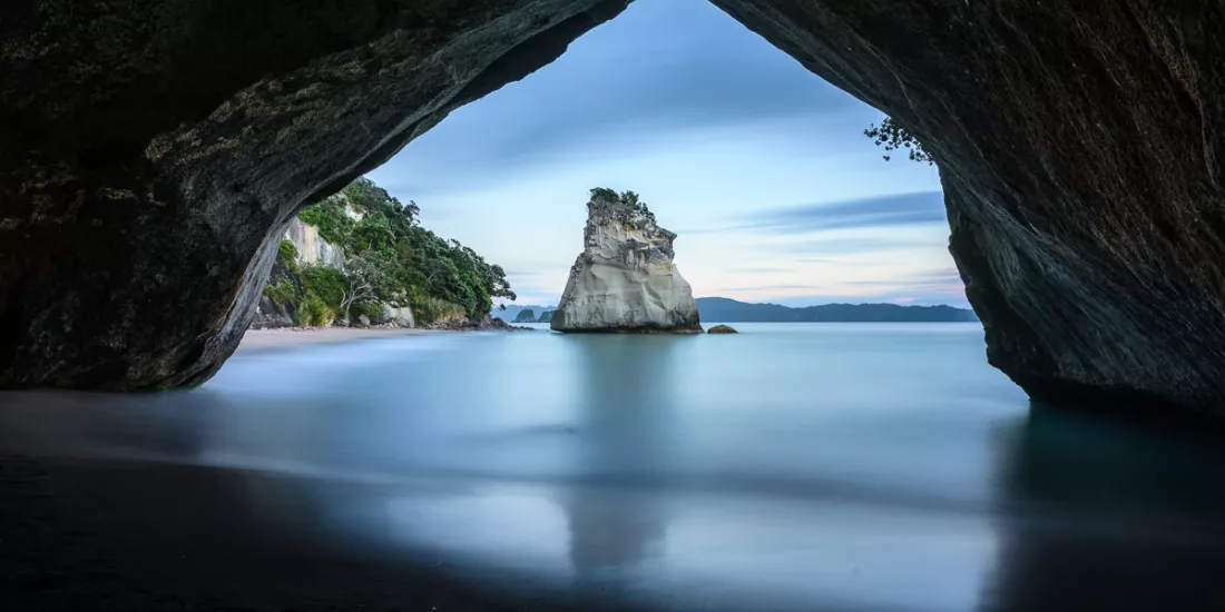 Cathedral Cove framed by natural limestone arch, Coromandel Peninsula