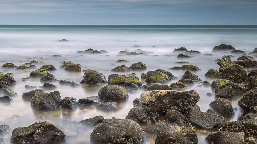 Rocky surf and tide pools along the shores of Coromandel Peninsula