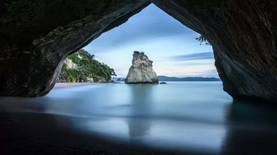 Cathedral Cove framed by natural limestone arch, Coromandel Peninsula