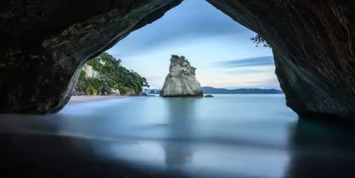 Cathedral Cove framed by natural limestone arch, Coromandel Peninsula