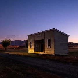 Old wooden building glowing at dusk in Oturehua, Central Otago