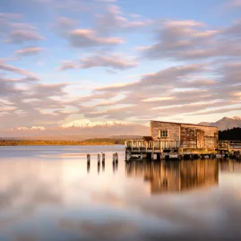 Ōkārito Lagoon reflecting Southern Alps on New Zealand’s West Coast