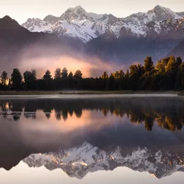 Lake Matheson reflecting Mount Cook and Mount Tasman on West Coast South Island