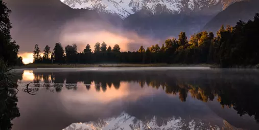 Lake Matheson reflecting Mount Cook and Mount Tasman on West Coast South Island
