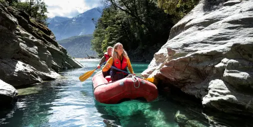 Funyak rafting through narrow canyon on the Dart River