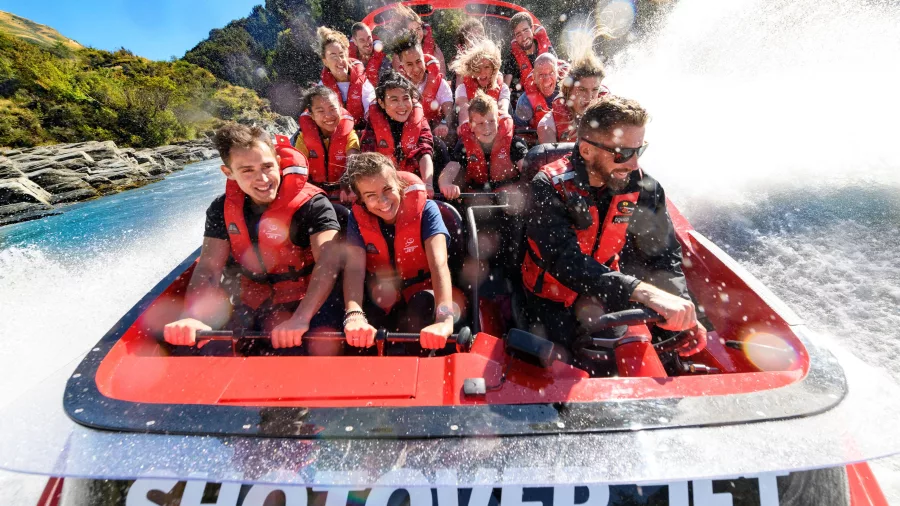 Smiling passengers on Shotover Jet boat ride