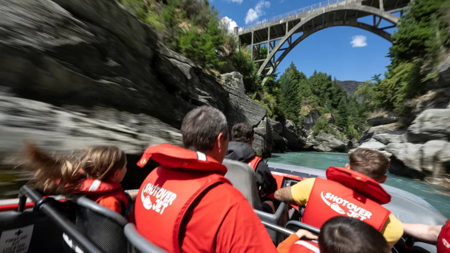 Shotover Jet speeding toward Edith Cavell Bridge