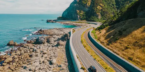 Wild Kiwi van driving the scenic coastal road from Blenheim to Kaikoura in New Zealand