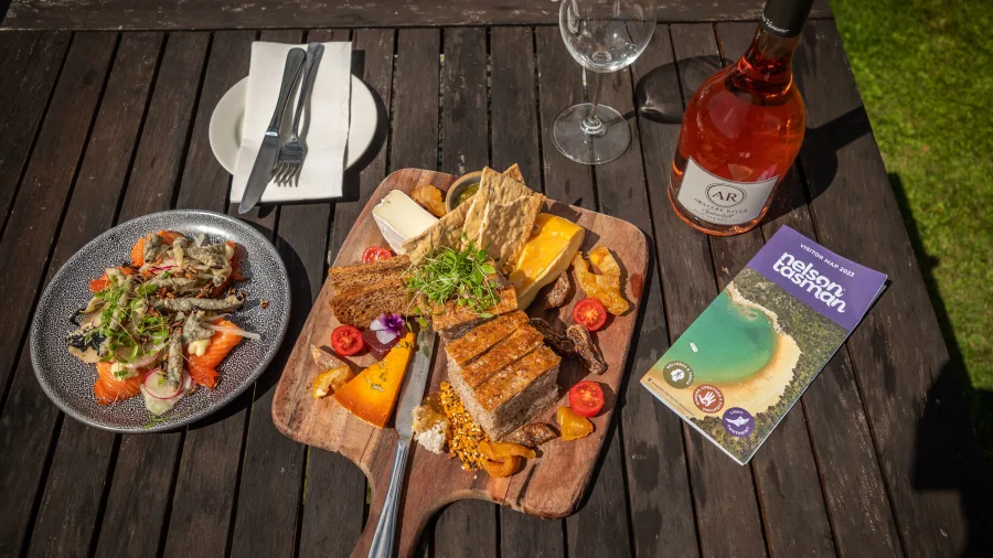 Artisan food platter with wine at Gravity Winery in Upper Moutere