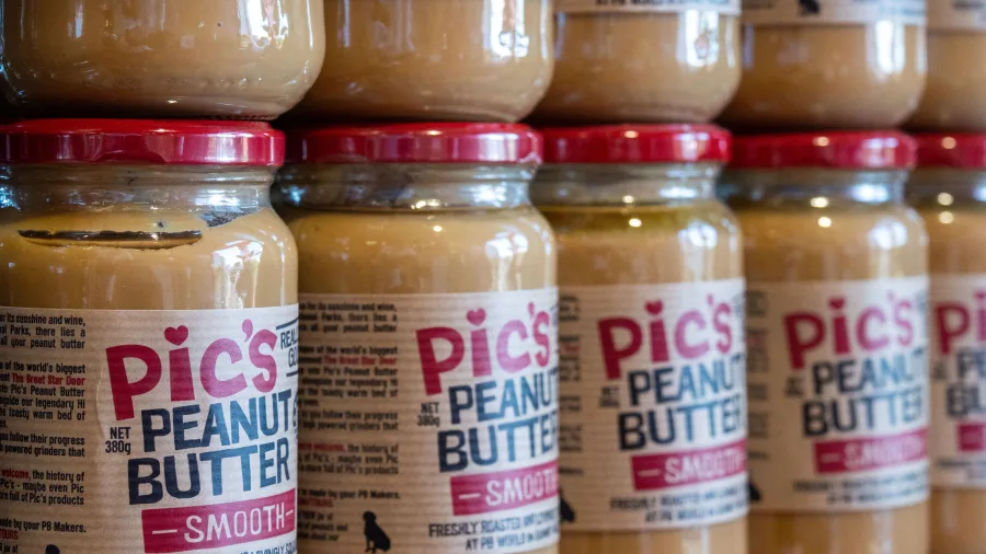 Jars of Pic’s Peanut Butter stacked on display in Nelson