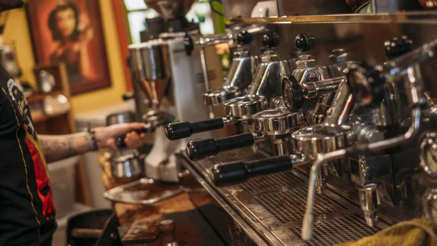 Barista preparing coffee at Wholemeal Café, Takaka