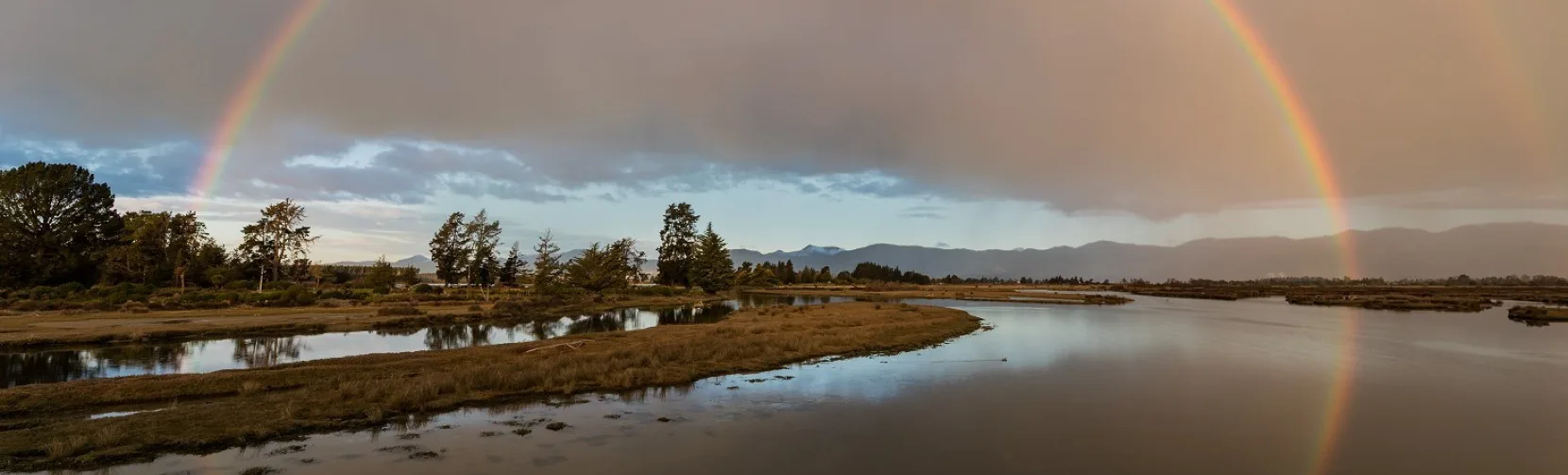 Full rainbow over wetlands on the Great Taste Trail, Ruby Coast, Nelson Tasman