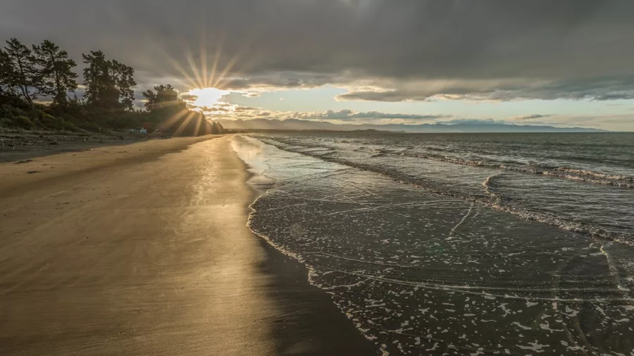 Evening reflections on the shoreline of Rabbit Island near the Great Taste Trail