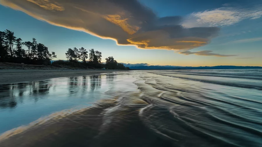 Sunset over Rabbit Island and the Ruby Coast in New Zealand