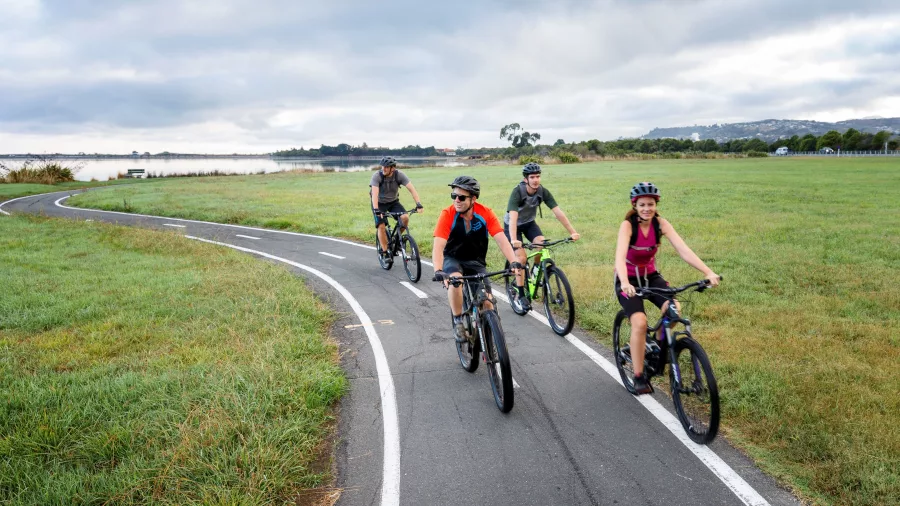 Group cycling the Great Taste Trail coastal path in Nelson Tasman New Zealand