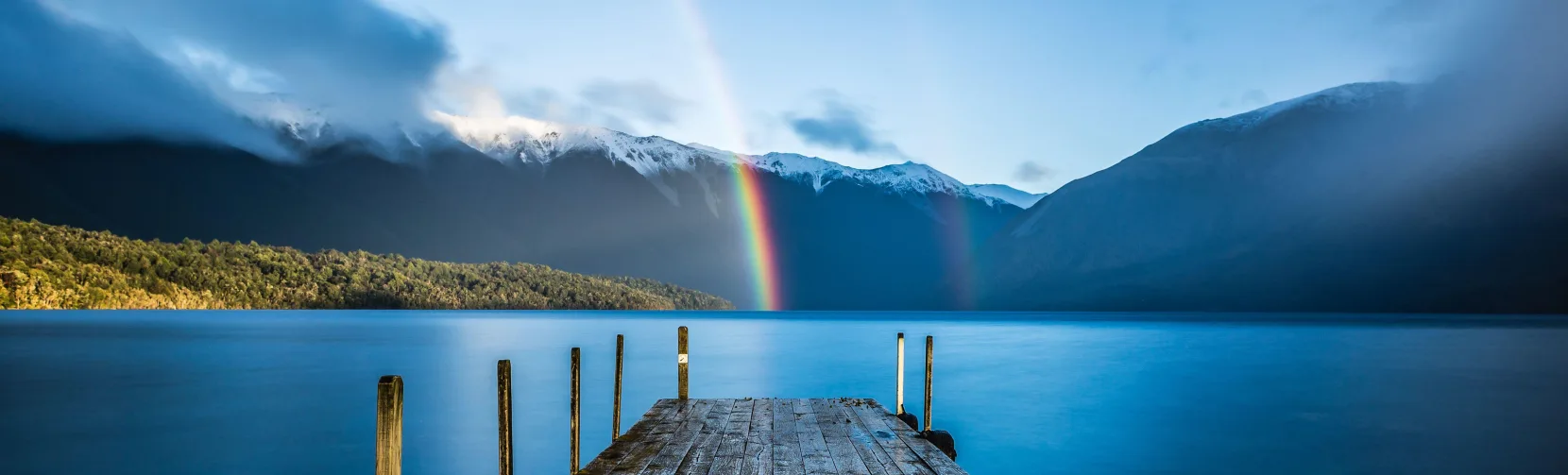 Rainbow over Lake Rotoiti jetty in Nelson Lakes National Park