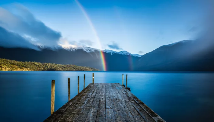 Rainbow over Lake Rotoiti jetty in Nelson Lakes National Park