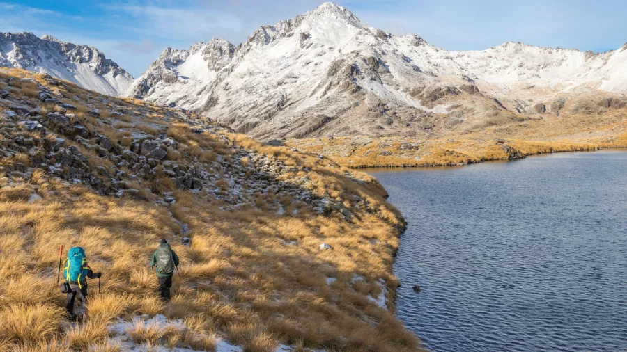 Trampers walking beside Lake Angelus in Nelson Lakes National Park
