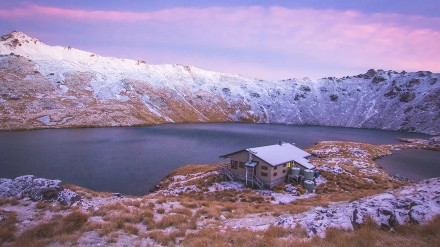 Lake Angelus Hut in snowy alpine setting Nelson Lakes National Park