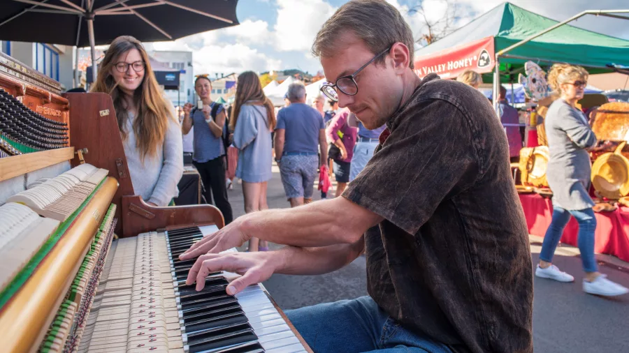 Musician playing piano at Nelson Saturday Farmers Market in New Zealand