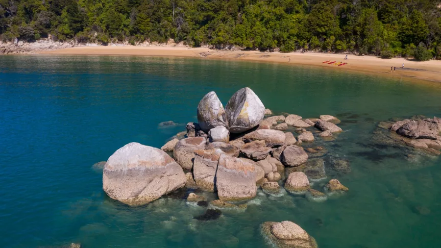 Split Apple Rock surrounded by clear turquoise water in Abel Tasman National Park