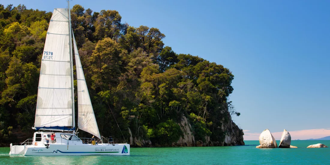 Sailing past Split Apple Rock with Abel Tasman Sailing Adventures