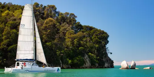 Sailing past Split Apple Rock with Abel Tasman Sailing Adventures