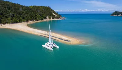 Catamaran anchored near Adele Island in Abel Tasman National Park