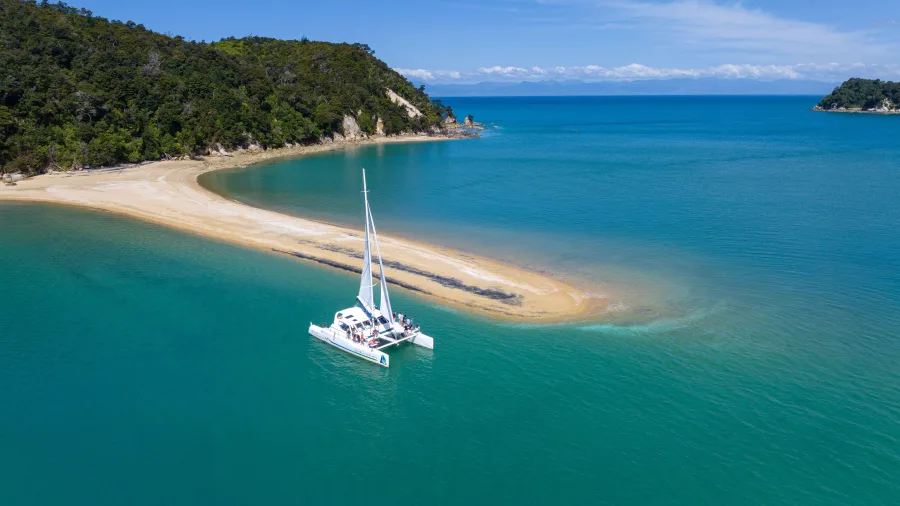 Catamaran anchored near Adele Island in Abel Tasman National Park