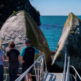 Visitors viewing Split Apple Rock from Abel Tasman Sea Shuttle platform
