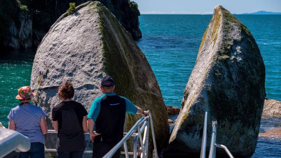 Visitors viewing Split Apple Rock from Abel Tasman Sea Shuttle platform