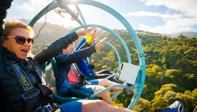 Riders enjoying the Skywire adventure on a sunny day at Cable Bay Adventure Park in Nelson