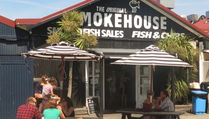 People dining outside The Smokehouse during Magical Mapua tour