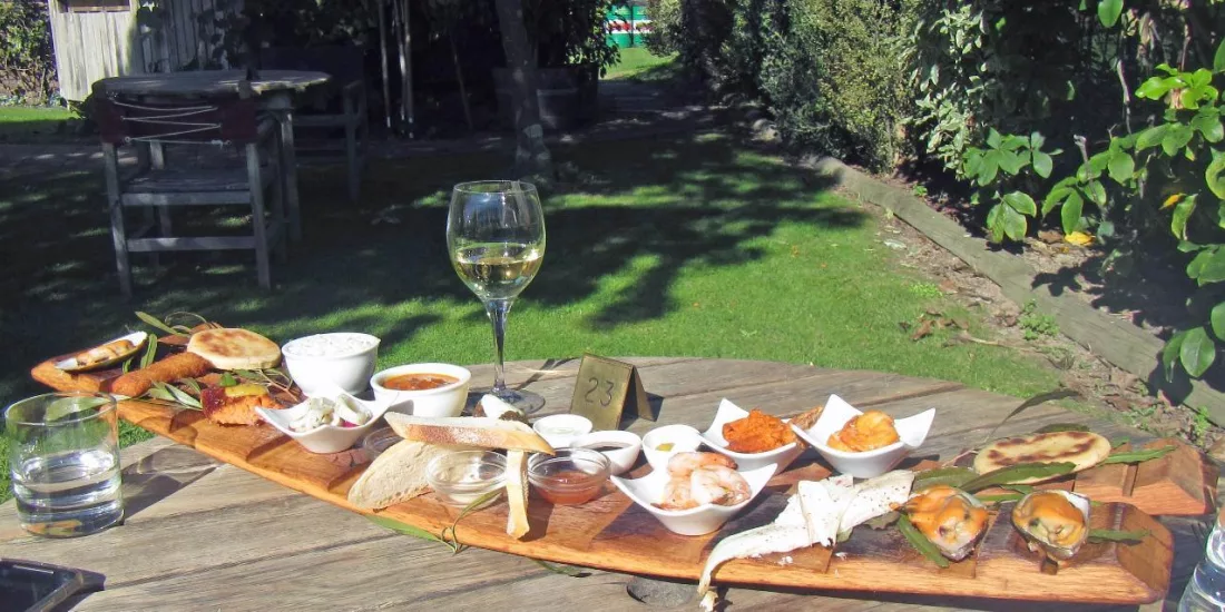 Petit Fleur tasting platter with wine on Moutere Hills E-bike tour