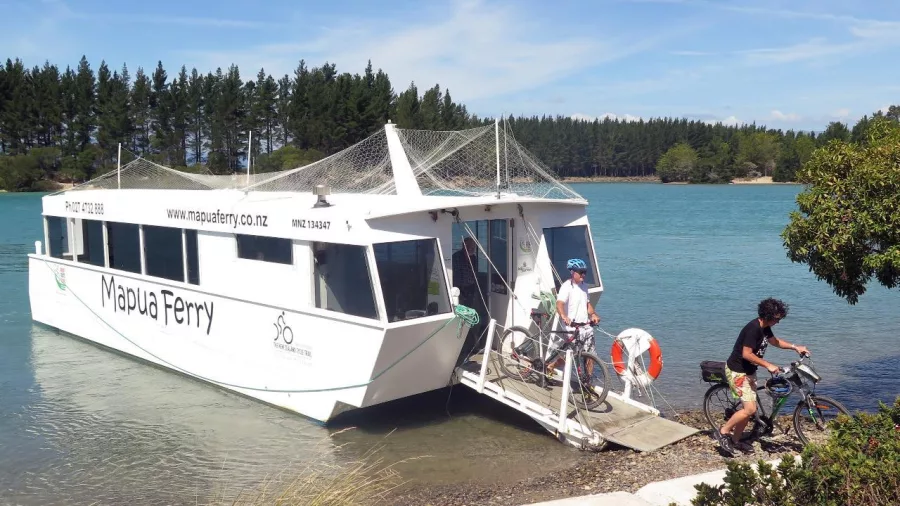Cyclists disembarking from Mapua Ferry during Moutere E-bike tour