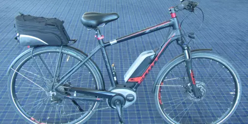 Large Scott electric bike with carrier case available for hire at Nelson Cycle Hire