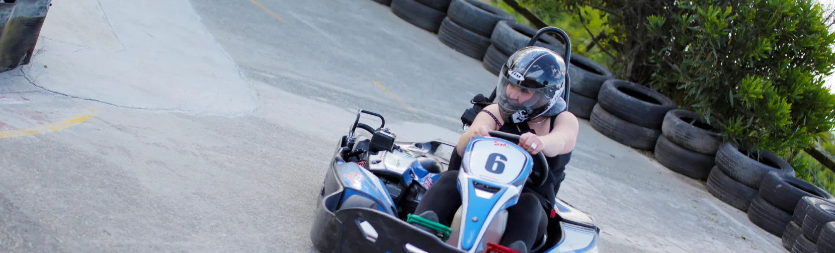 Solo driver navigating a sharp corner in kart number 6 at Pro Karts in Nelson