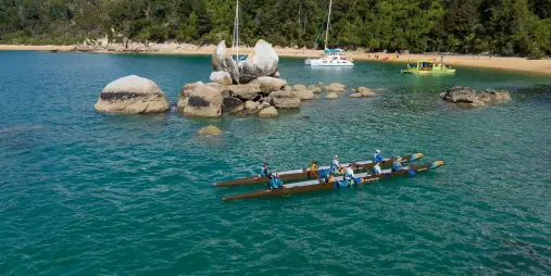 Waka outrigger canoe near Split Apple Rock Abel Tasman National Park New Zealand