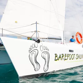 Closeup view of the Barefoot Sailing Adventures catamaran sailing in the Bay of Islands