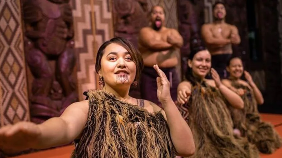 Māori performers in traditional dress during a cultural experience in the Bay of Islands