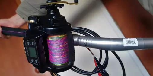 Electric fishing reel with multicolour braid used for deep sea hapuka fishing